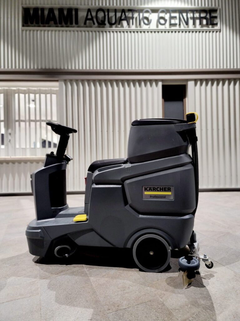 Inticlean using Karcher floor scrubber machine at Miami aquatic centre entrance