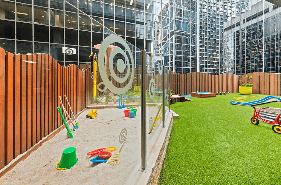 Outdoor childcare play area with sandpit and toys maintained by Inticlean childcare cleaning services