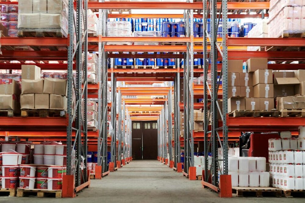 Inticlean warehouse cleaning service showing neat aisles with stacked storage boxes